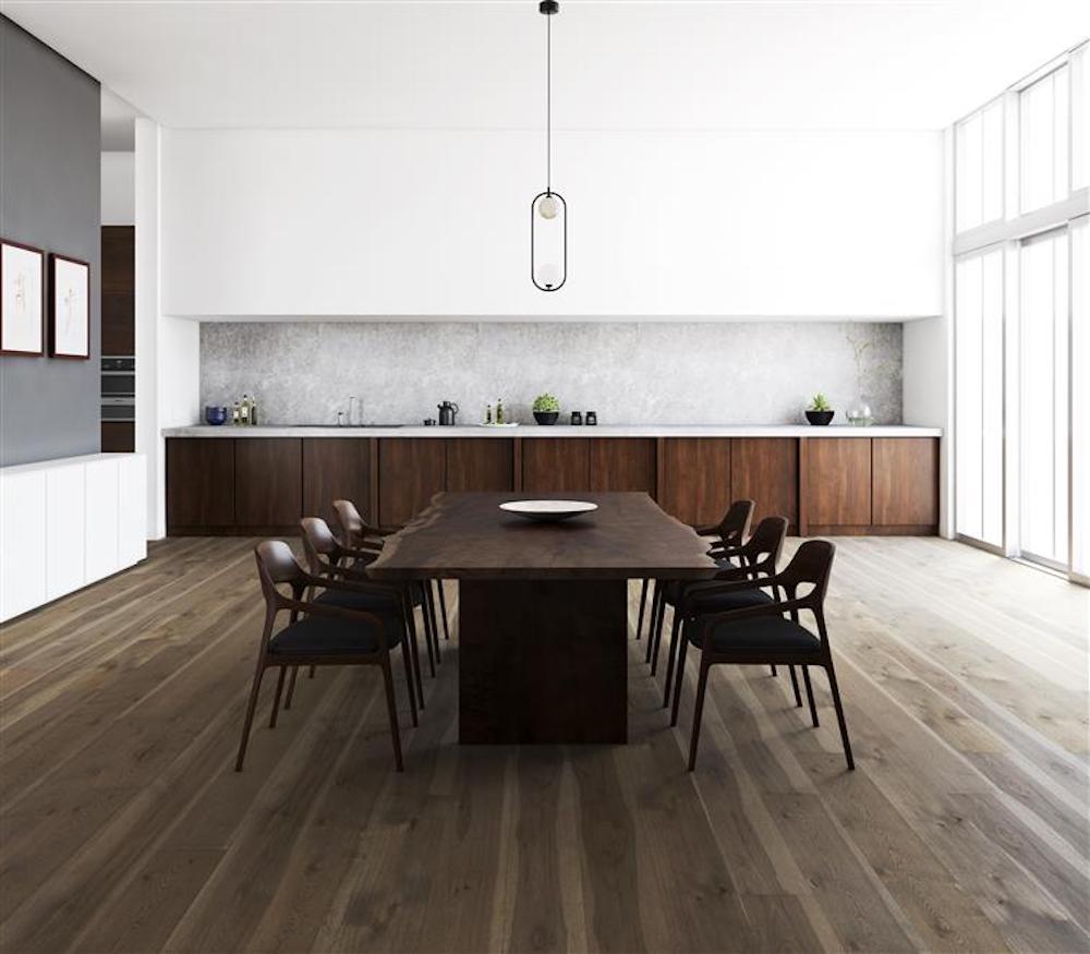 A contemporary kitchen featuring wooden floors and sleek white walls, creating a bright and inviting atmosphere.